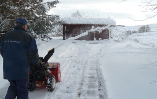 first snow of the season snowblowing at the log cabins