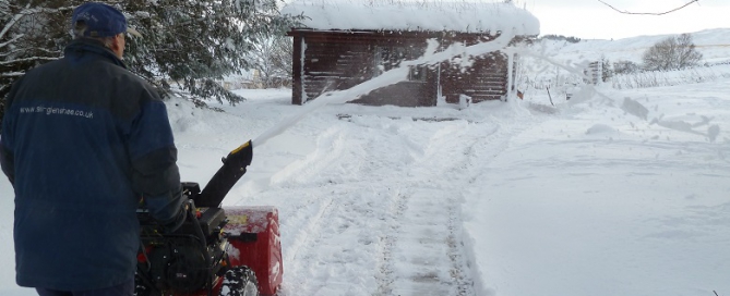 first snow of the season snowblowing at the log cabins